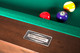 Doc & Holliday Billiards engraved steel name plate detail, shown on the Paula Parsons Slate Pool Table in Antique Coffee finish. Doc & Holliday Billiards engraved steel name plate detail, shown on the Paula Parsons Slate Pool Table in Antique Coffee finish.
